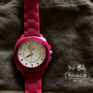 Authentic fuchsia Coach. Signature C face with soft rubber strap.
